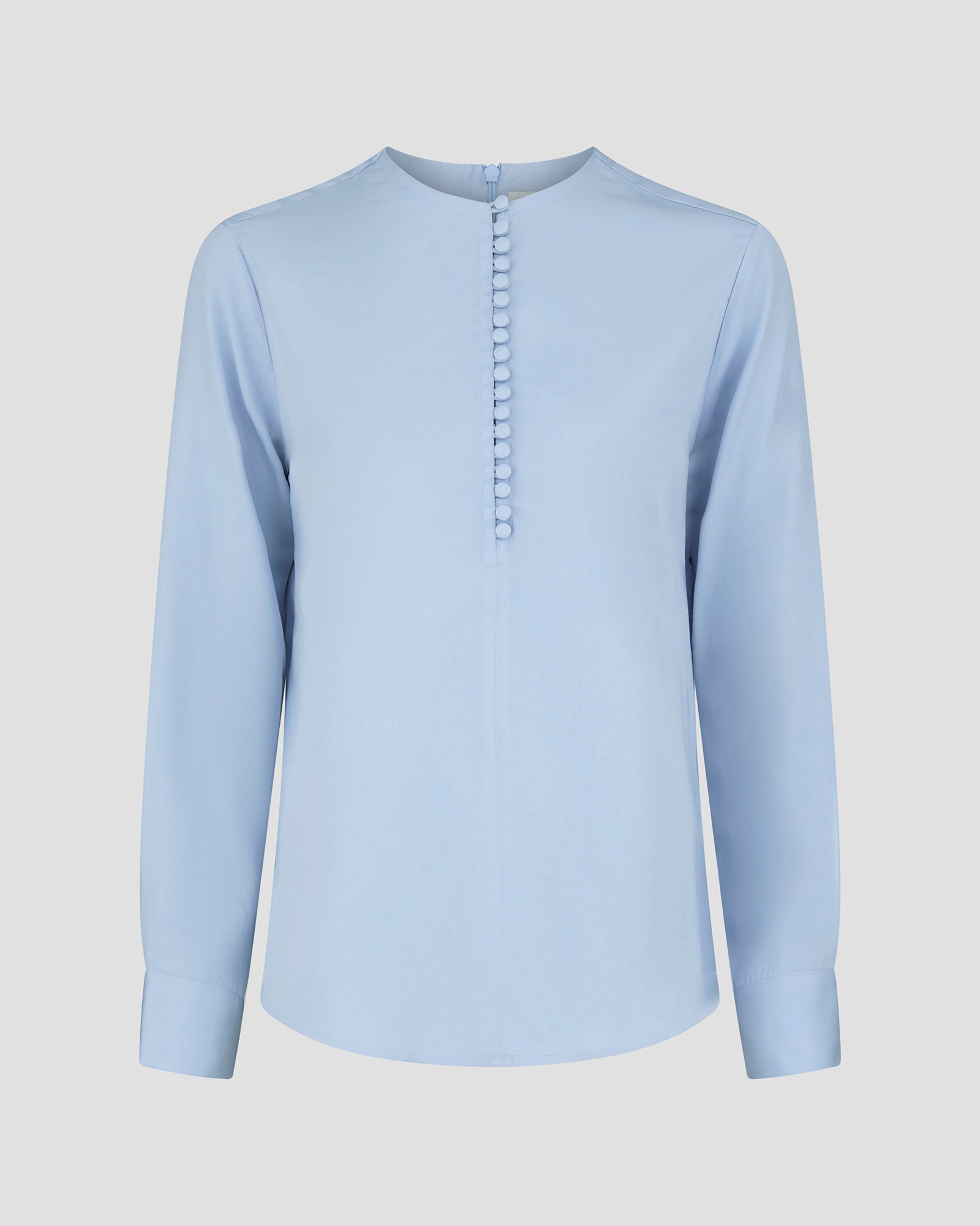 Skjortebluse til damer i lyseblaa lavet af kvaliteten 100% Viskose (LENZING™ ECOVERO™), ansvarligt produceret design fra A Working Theory